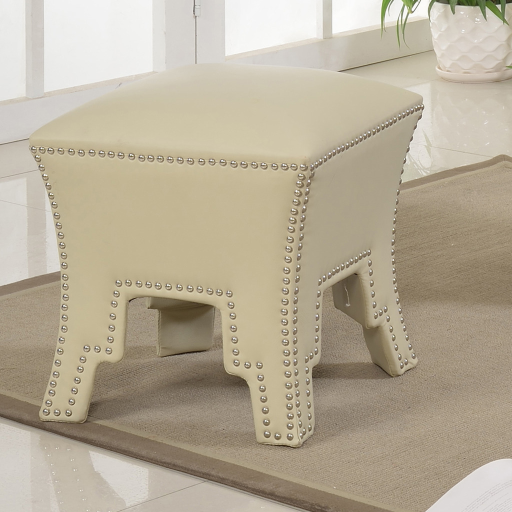 The Odessa Ottoman in Ivory works beautifully mixed with shades of red.