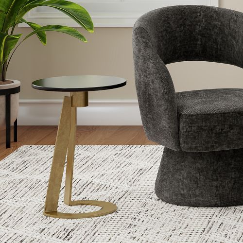 Devas Round Accent Table in Black and Aged Brass